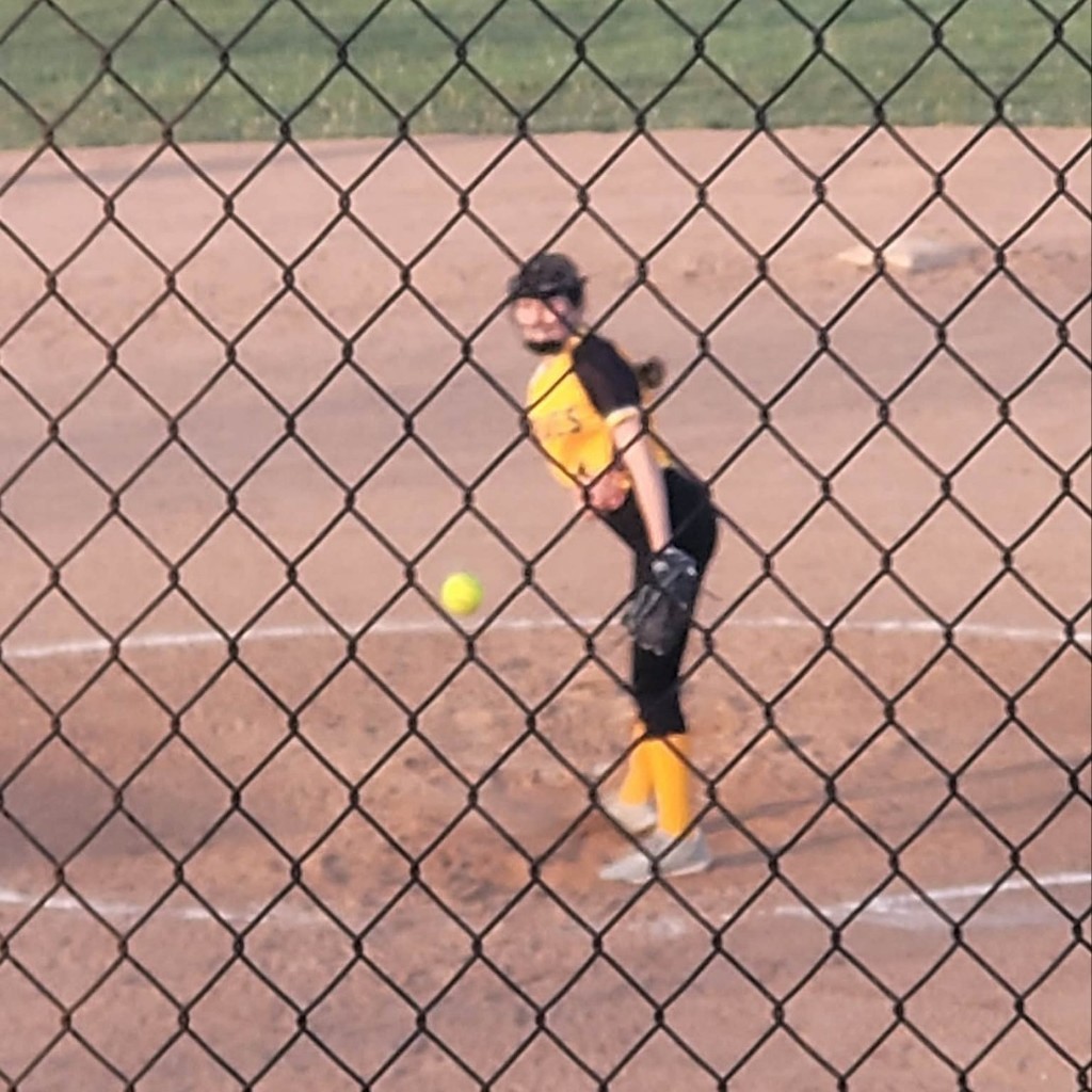 MS softball player pitching