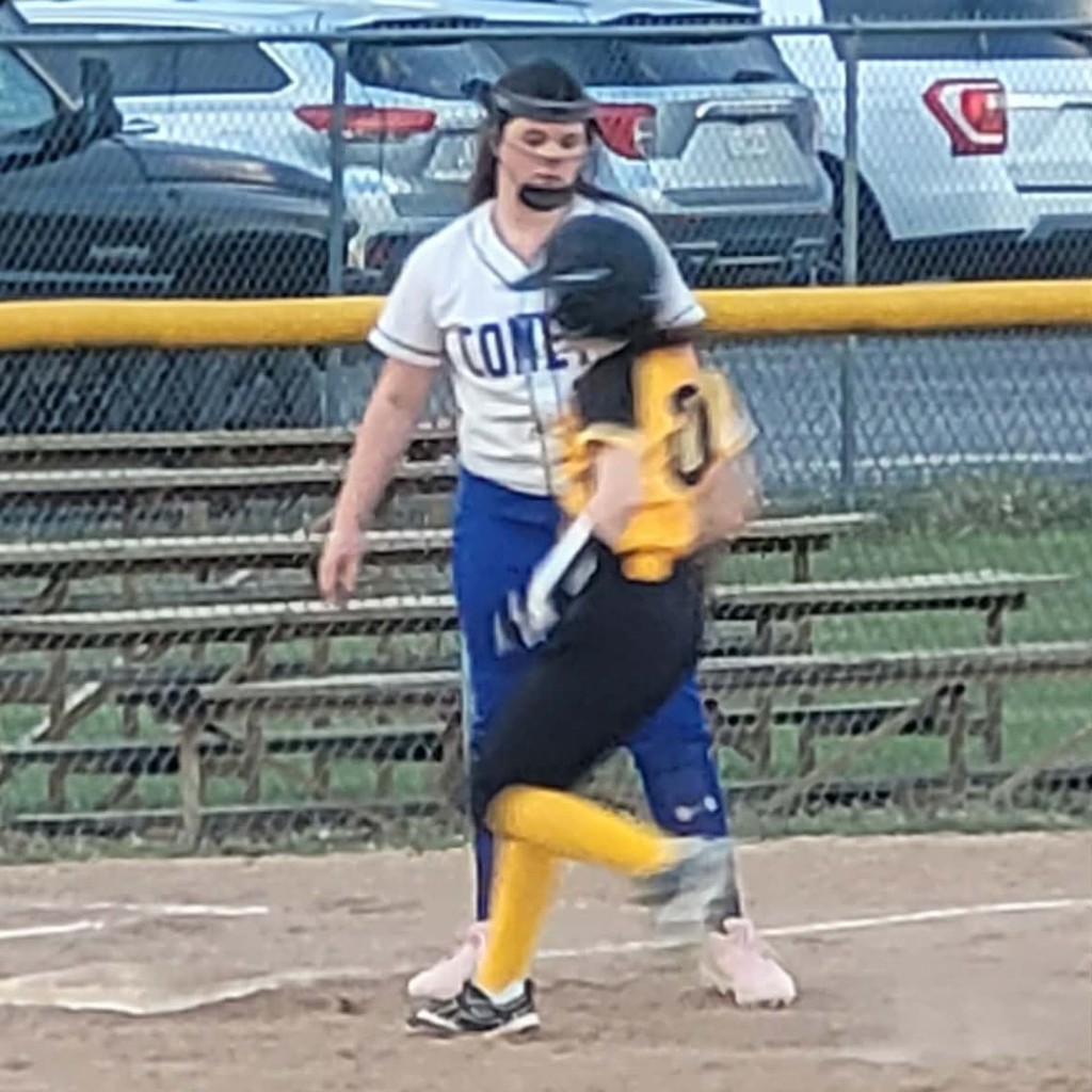 MS softball player running to 3rd base