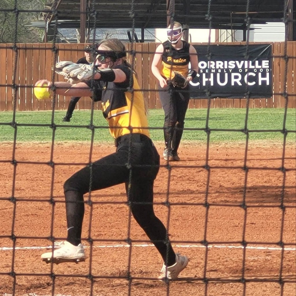 softball player pitching 