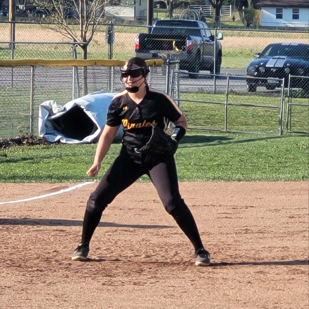 softball player at 3rd base ready to field the ball
