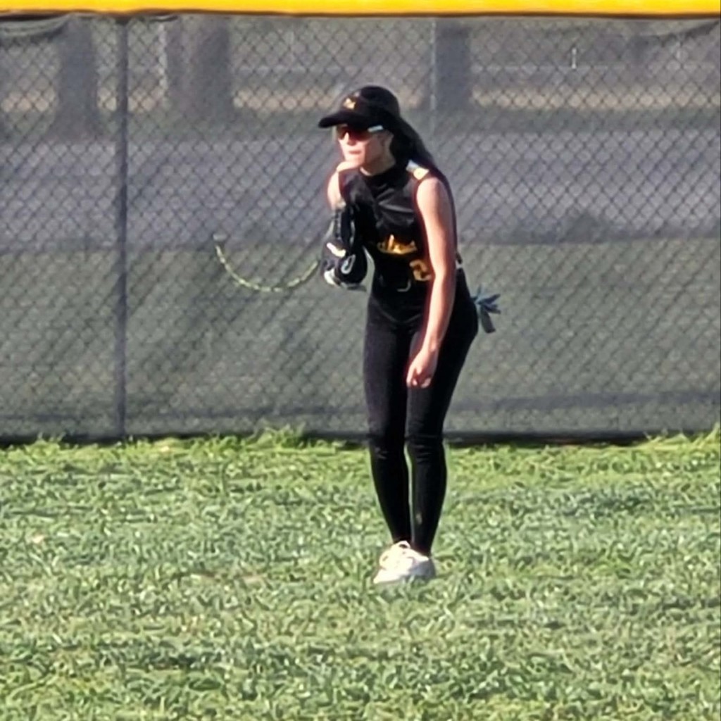 softball player in center field