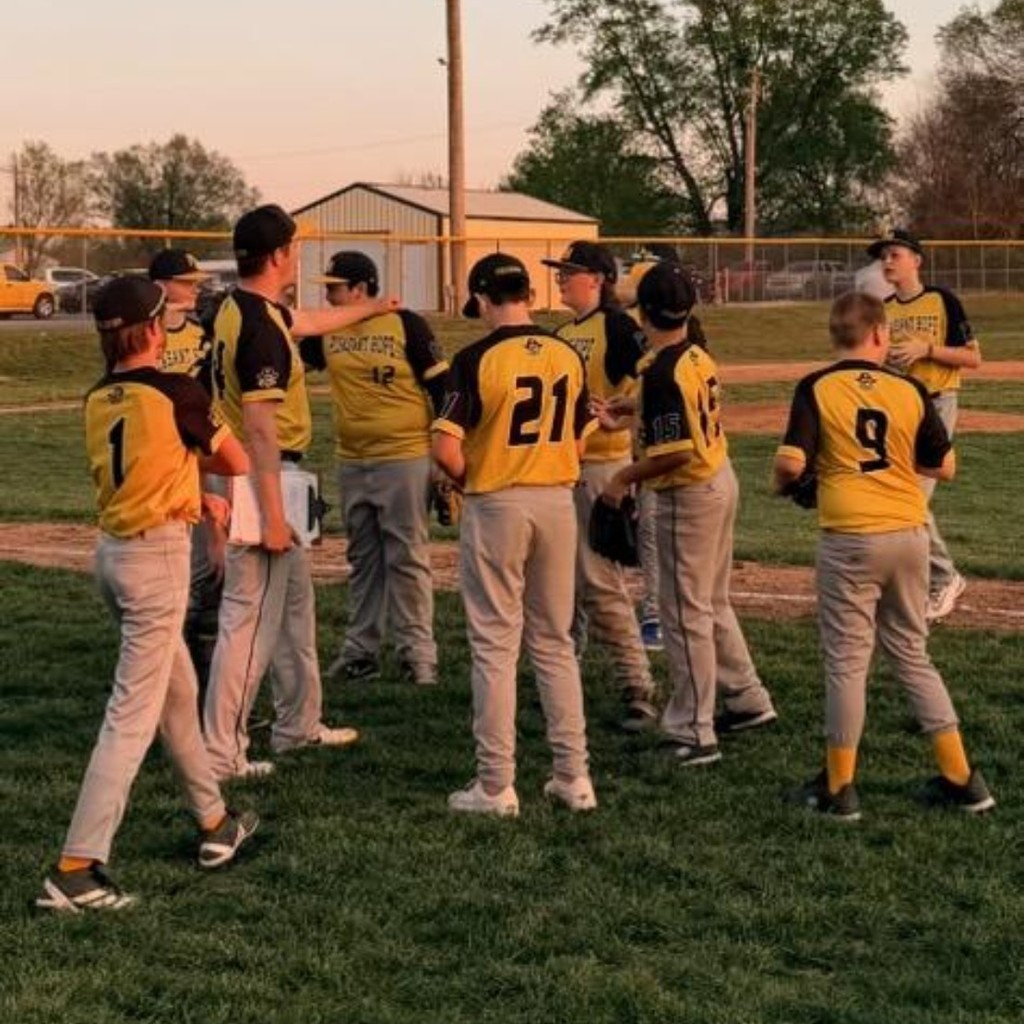 baseball coach talking to the players