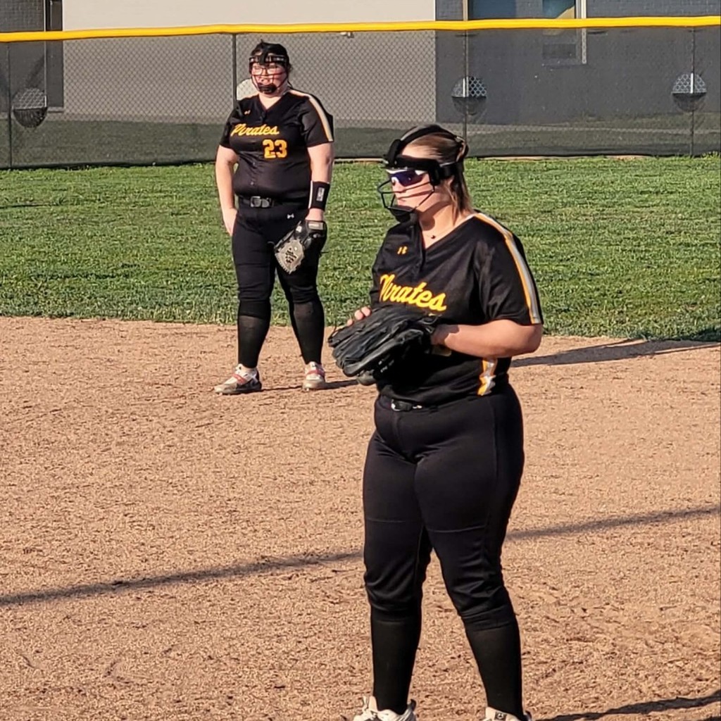 softball players on the infield