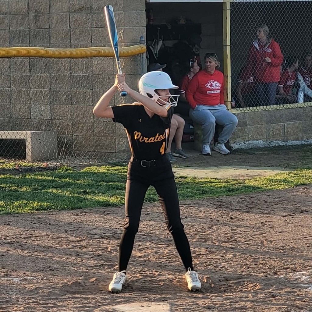 softball player up to bat