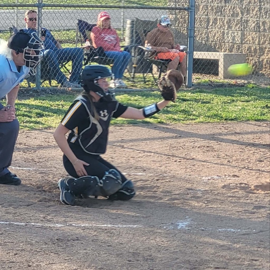 softball catcher catching the ball