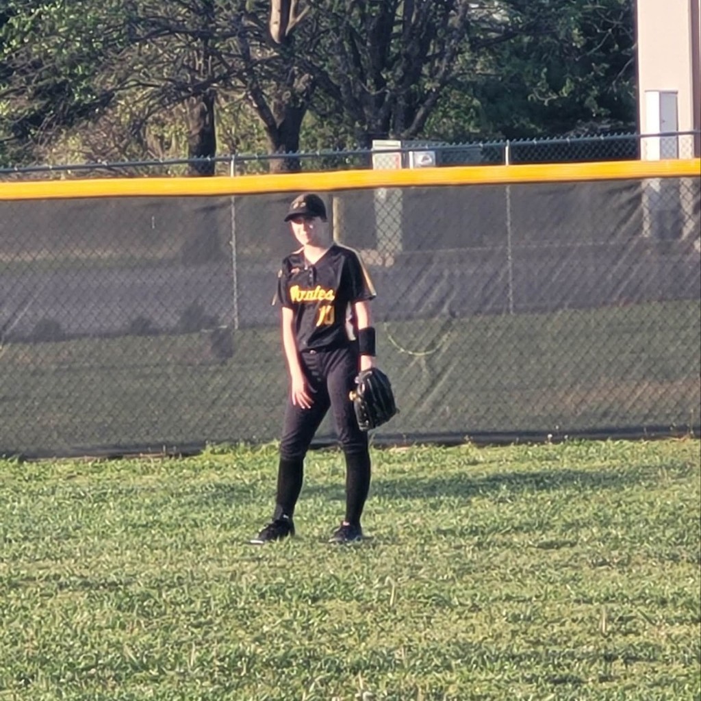 softball player in the outfield 