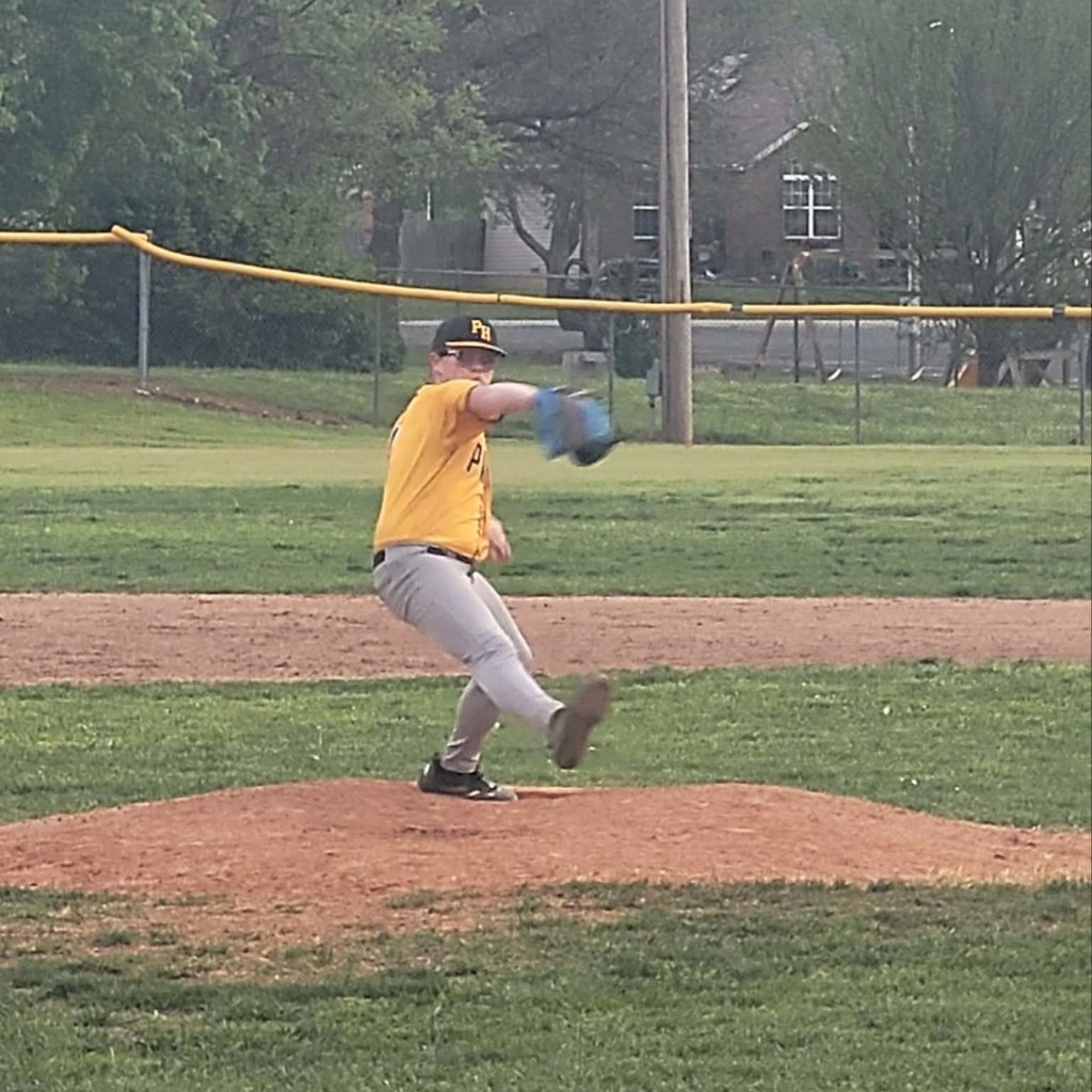 baseball pitcher in his windup.