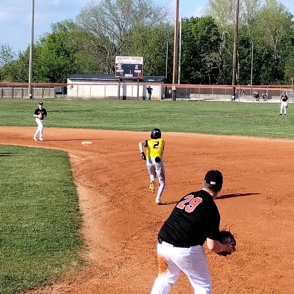 baseball player running to 2nd base