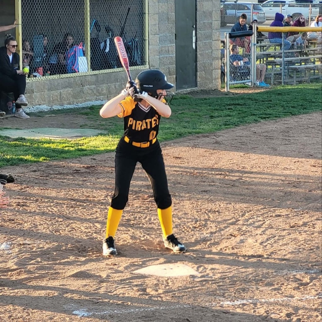 pleasant hope softball player batting 
