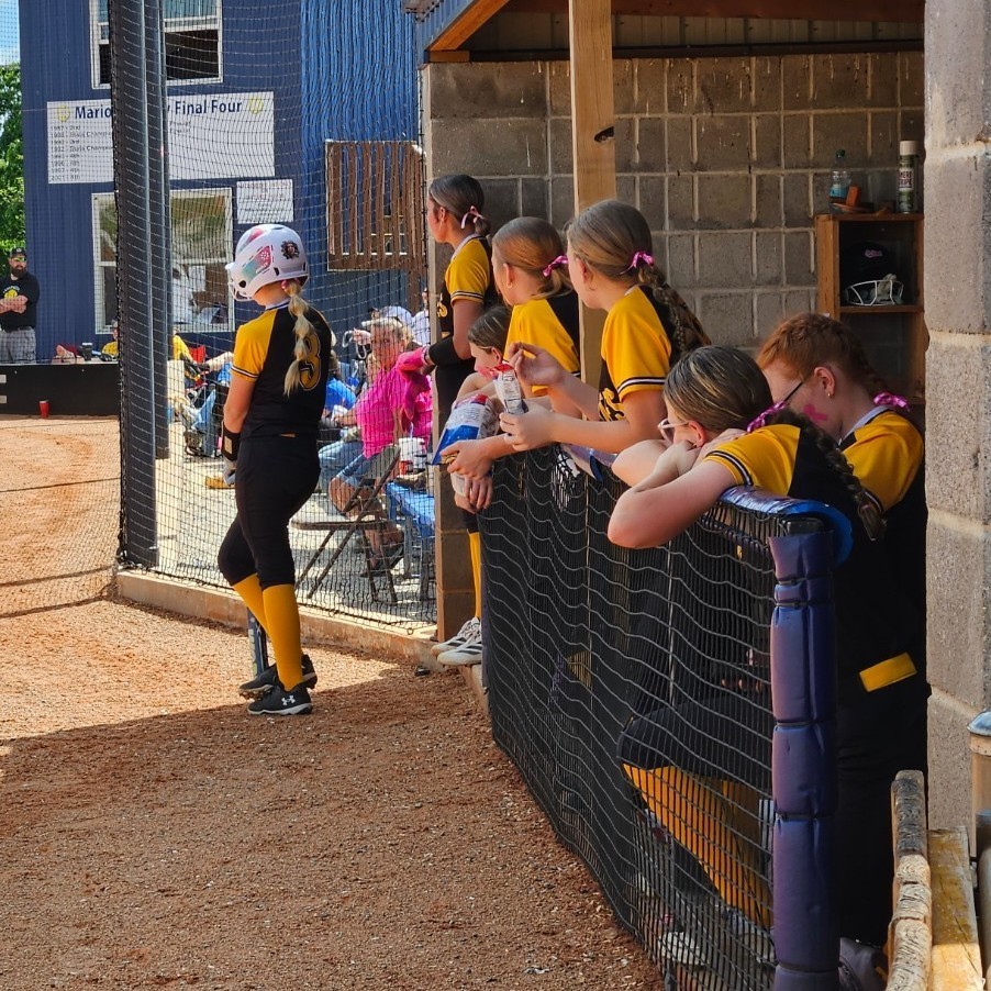 pleasant hope middle school softball players in the dugout 