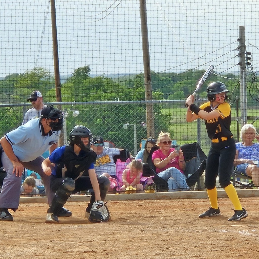 Pleasant Hope middle school softball player batting 