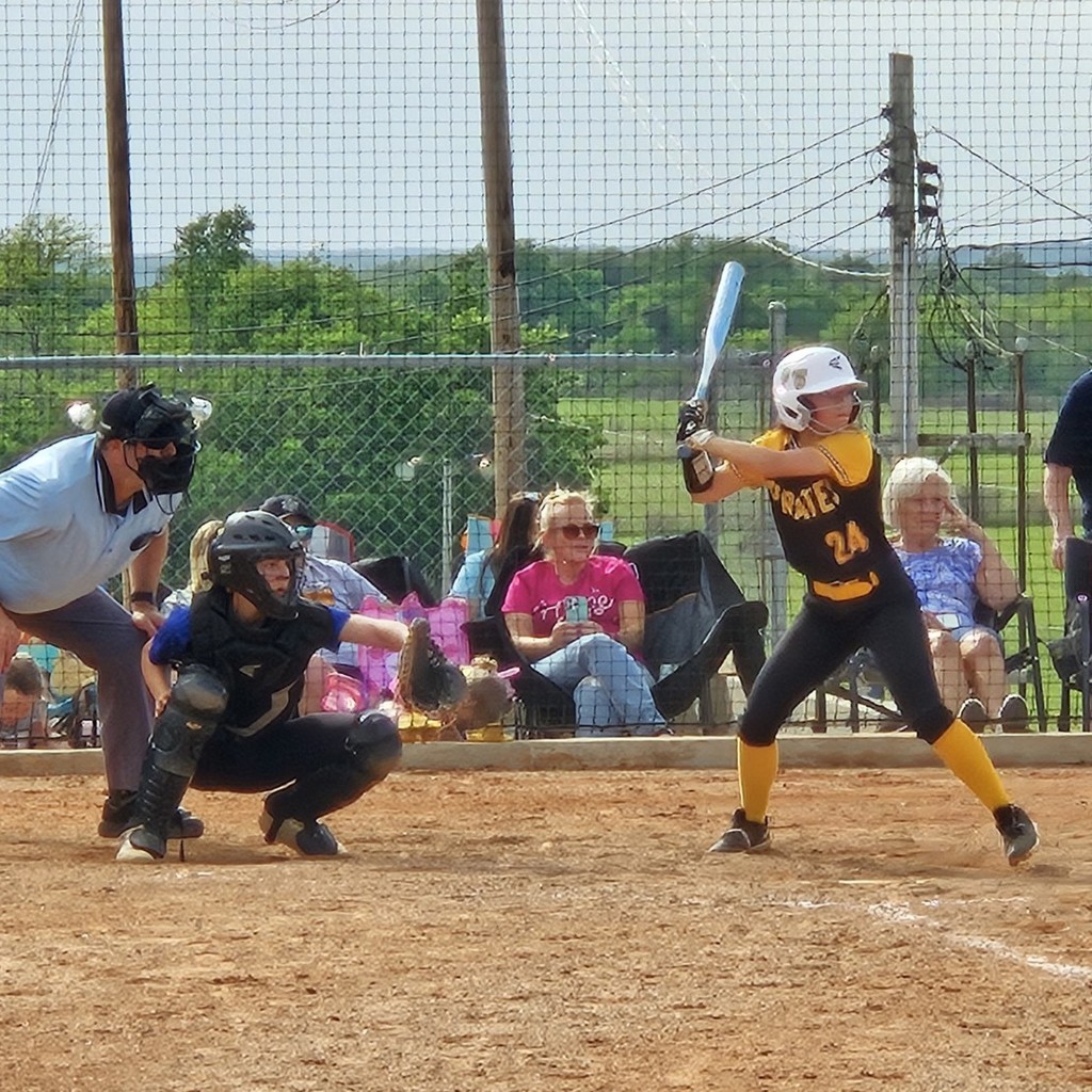 Pleasant Hope middle school softball player batting 