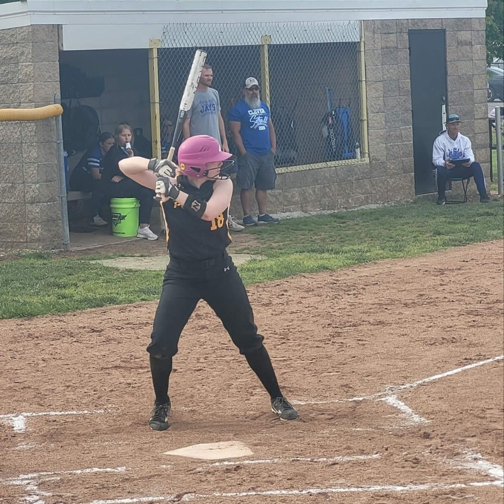 softball player batting 