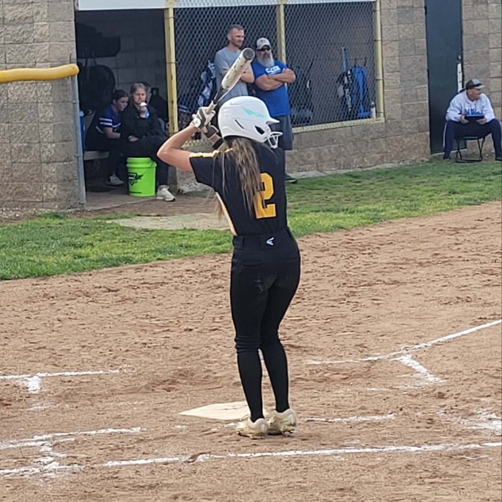 softball player batting 