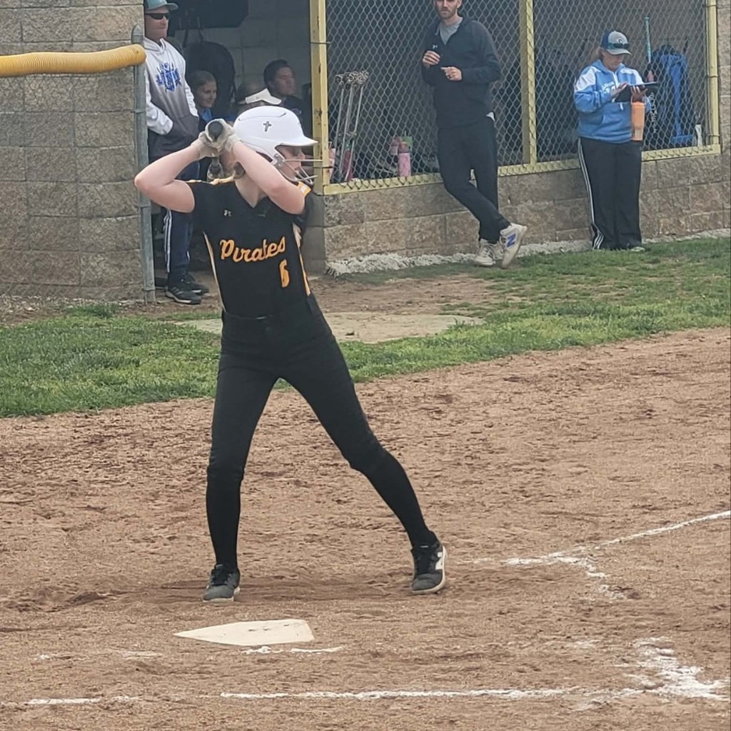 softball player batting 