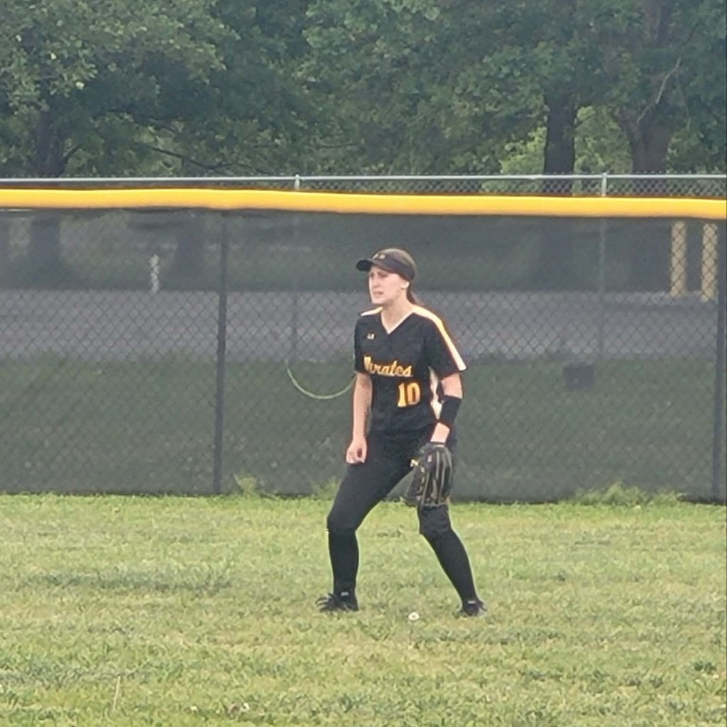 softball player in the outfield 