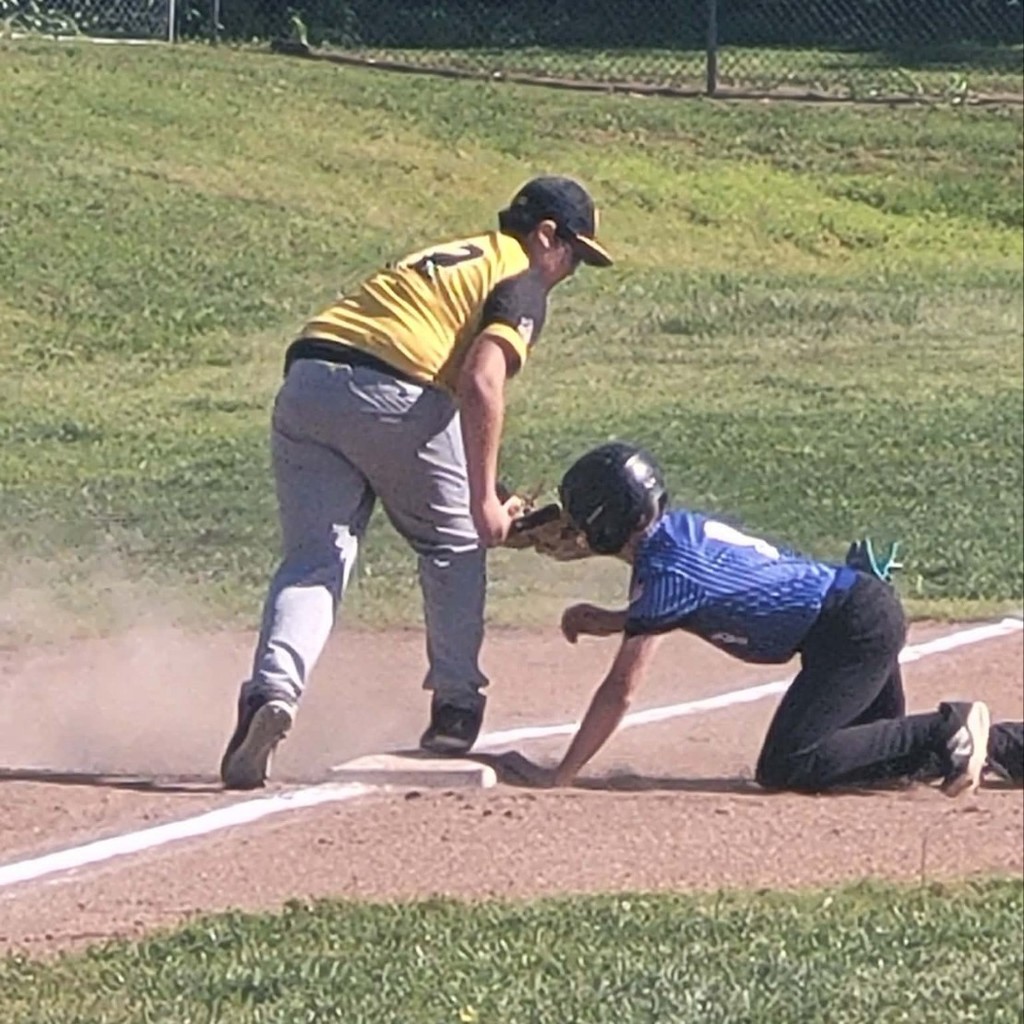 MS baseball player tagging the runner at 3rd base