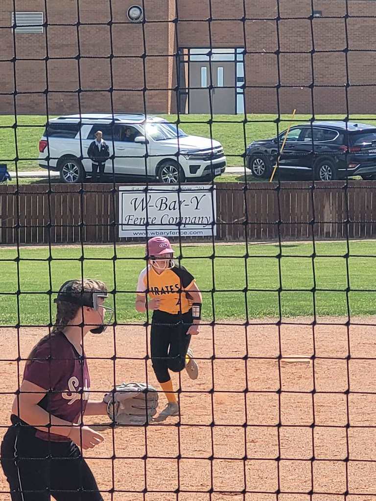 ms softball player running from 2nd to 3rd base