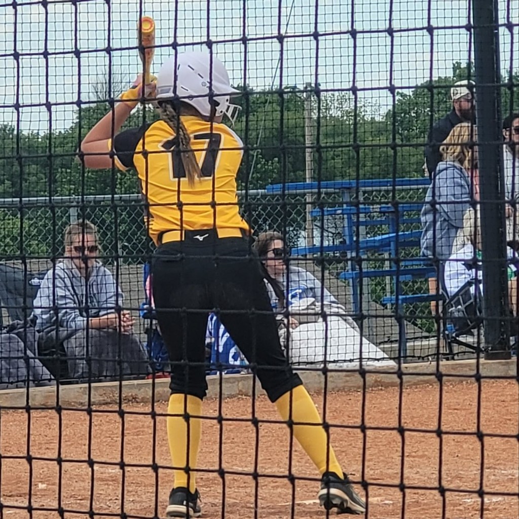 MS softball player batting 