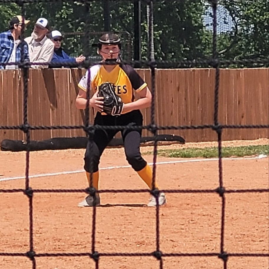 MS softball player on the infield 