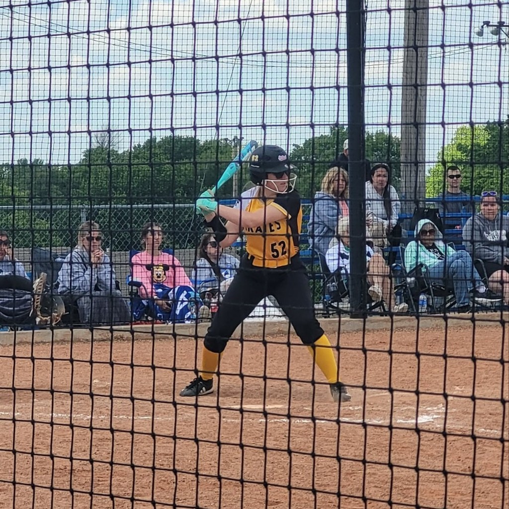 MS softball player batting 