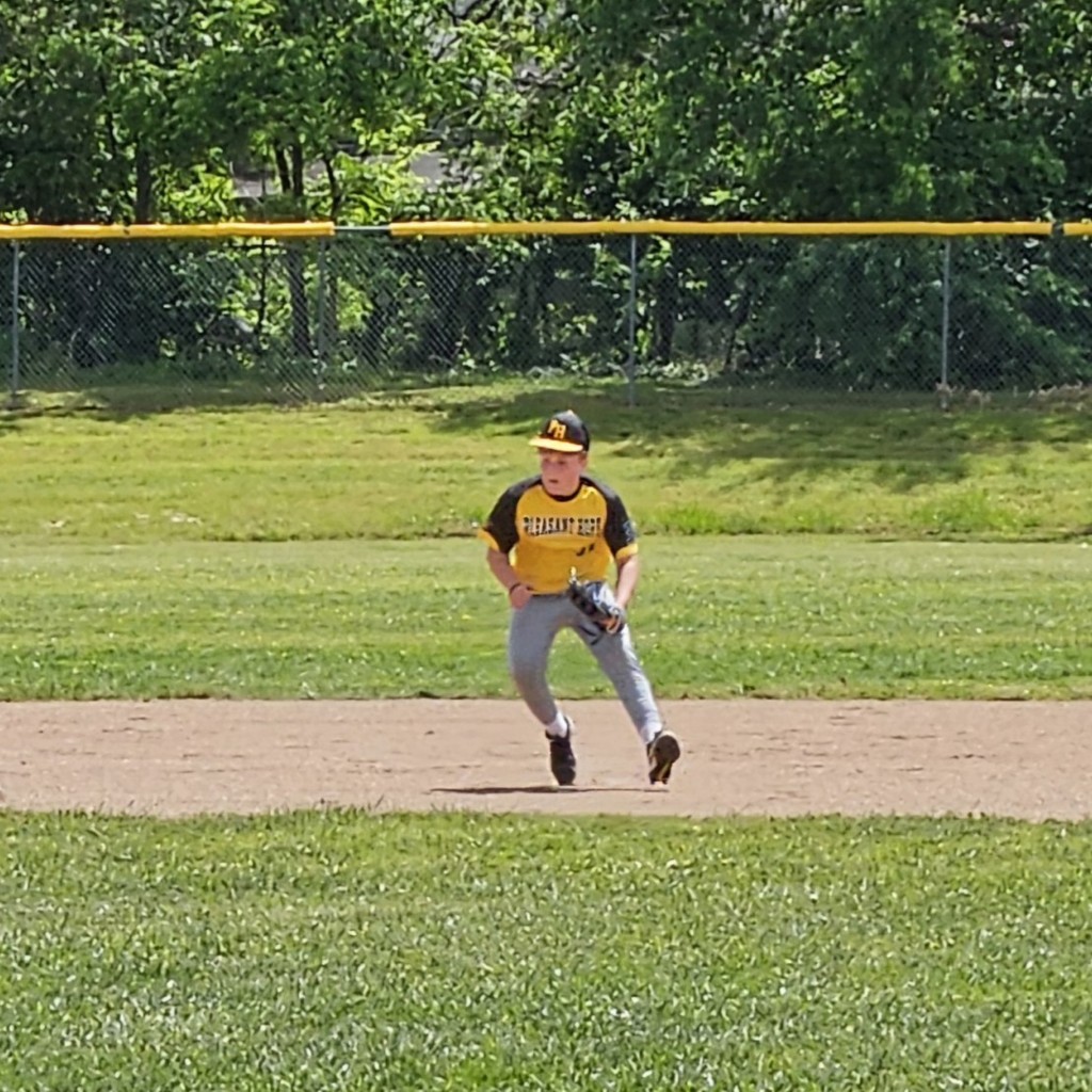 MS baseball player on the infield getting ready to field the ball 