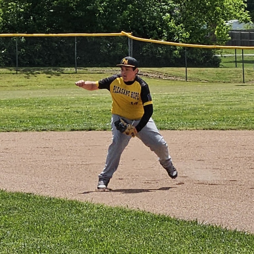 MS baseball player on the infield getting ready to field a ball