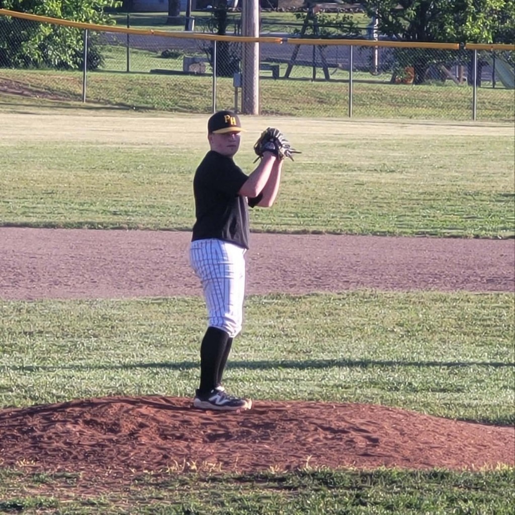 left handed hs baseball player getting ready to pitch