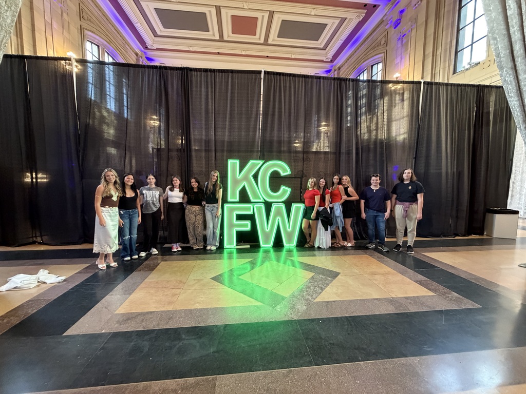 Group photo with KCFW sign