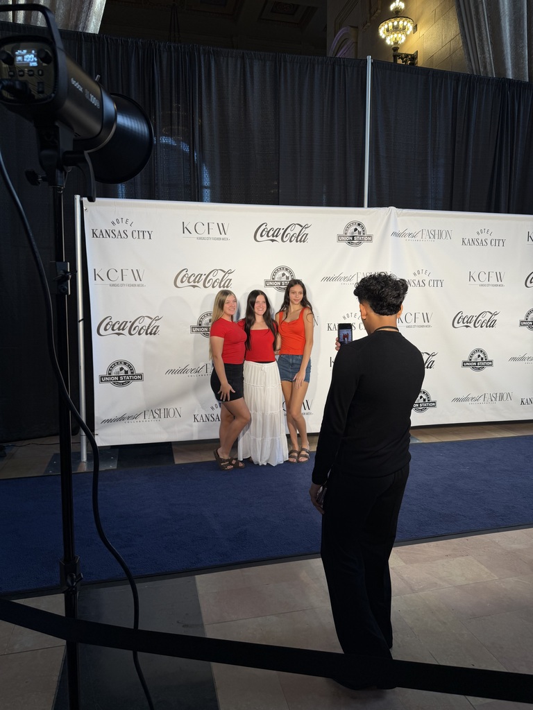 Students posing in photo line