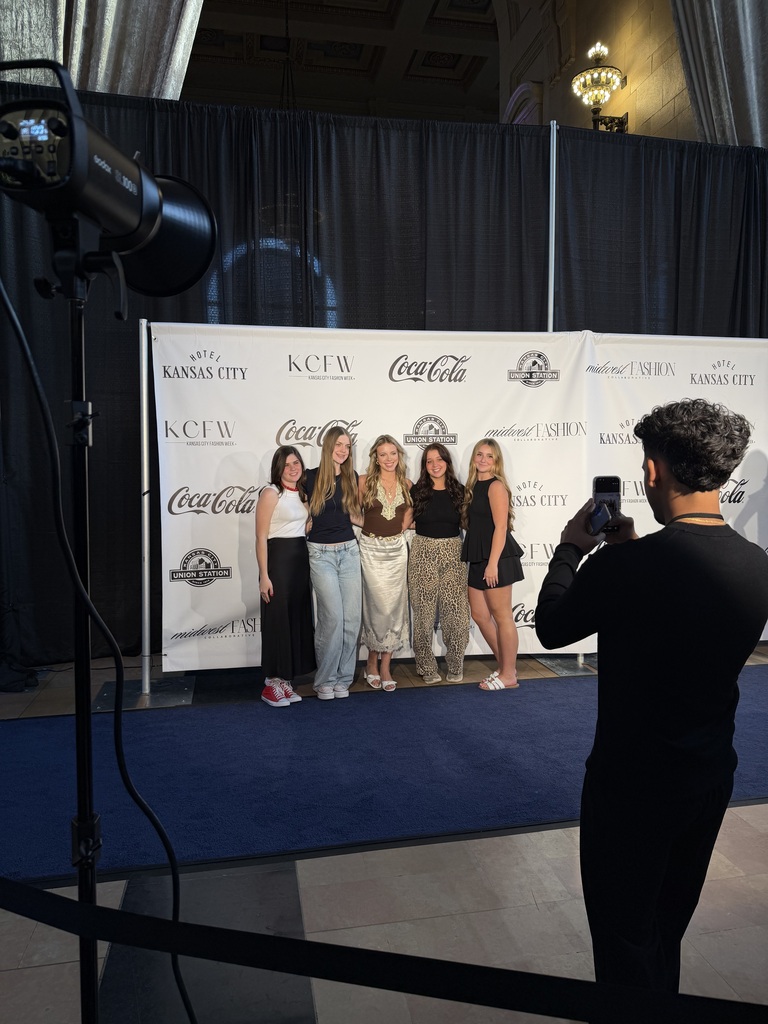 Students posing in photo line