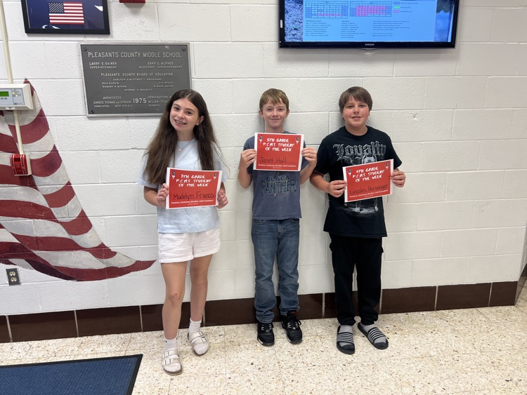 Group of 5th through 8th grade Students of the Week smiling and holding their certificates. The image celebrates their achievements in academics, leadership, and positive behavior at PCMS.