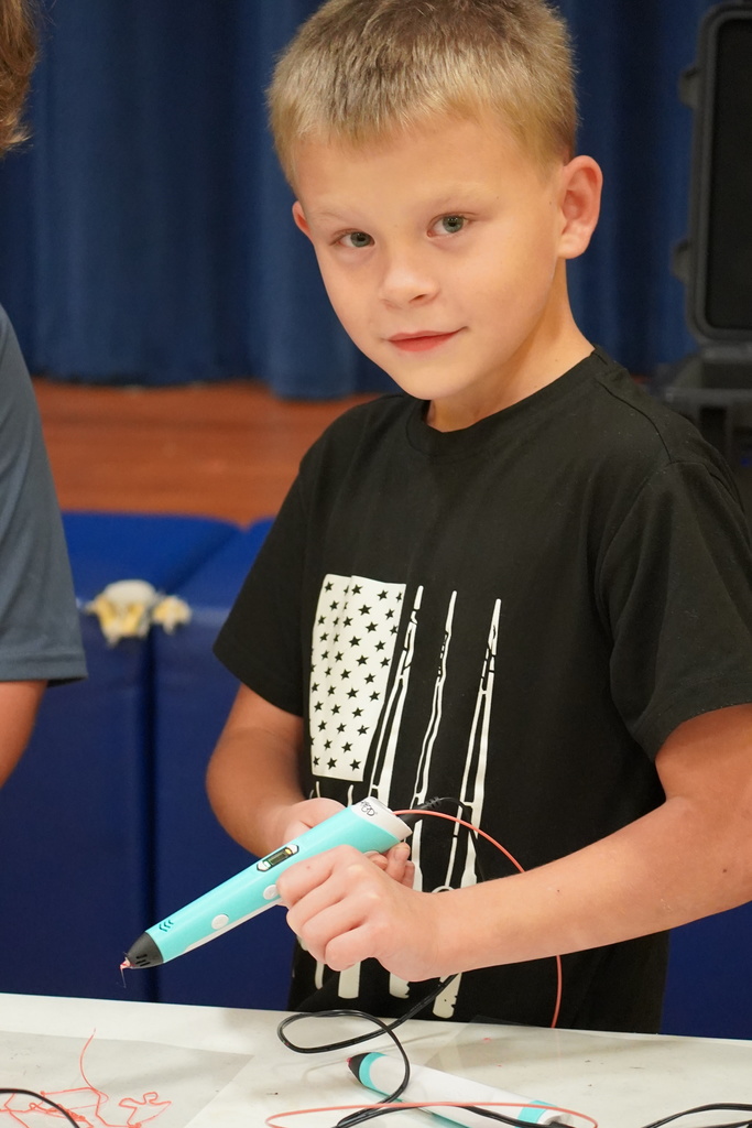 Students work with 3D pens