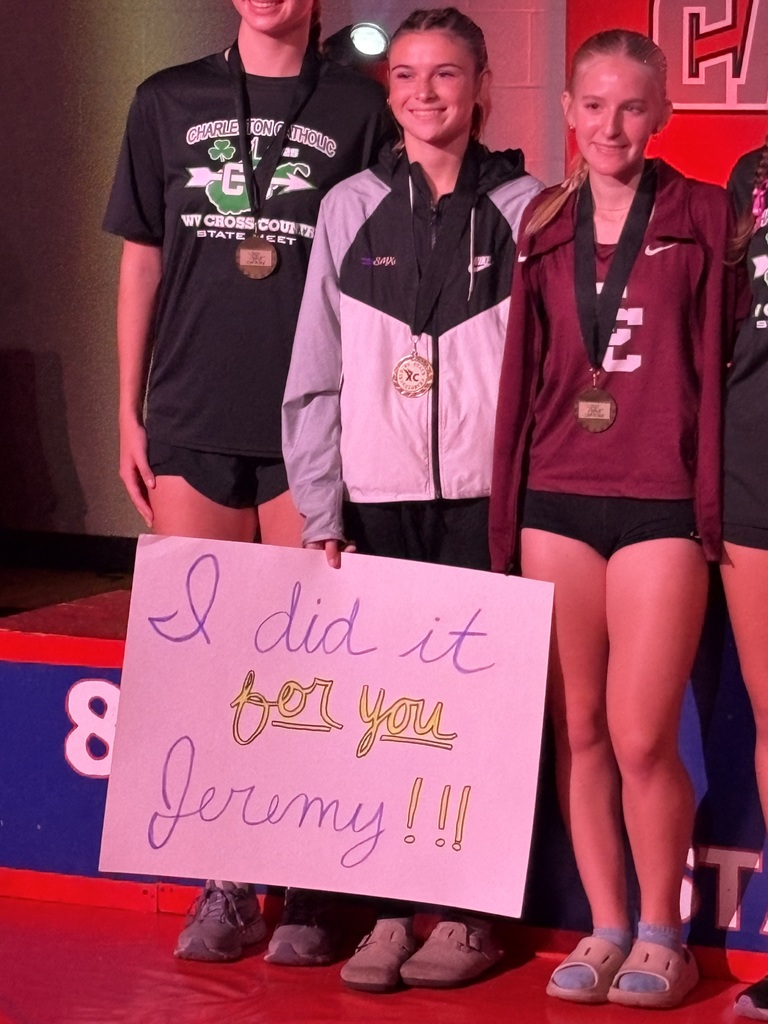 pic of runner holding sign for Jeremy