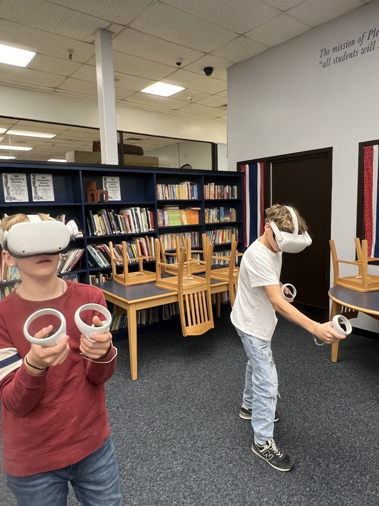 8th grade students using virtual reality headsets during a Workforce WV career exploration activity at PCMS.