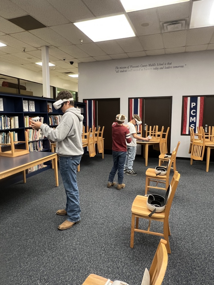 8th grade students using virtual reality headsets during a Workforce WV career exploration activity at PCMS.
