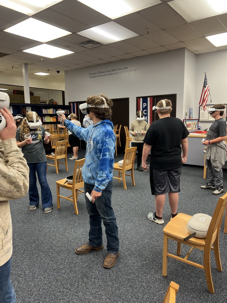 8th grade students using virtual reality headsets during a Workforce WV career exploration activity at PCMS.