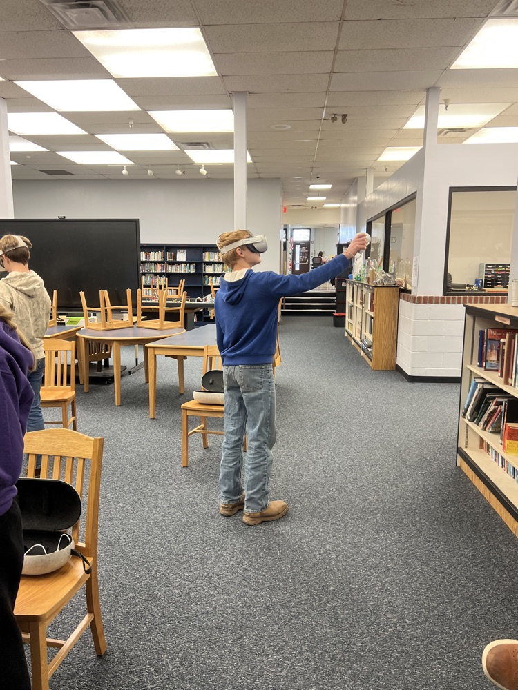 8th grade students using virtual reality headsets during a Workforce WV career exploration activity at PCMS.