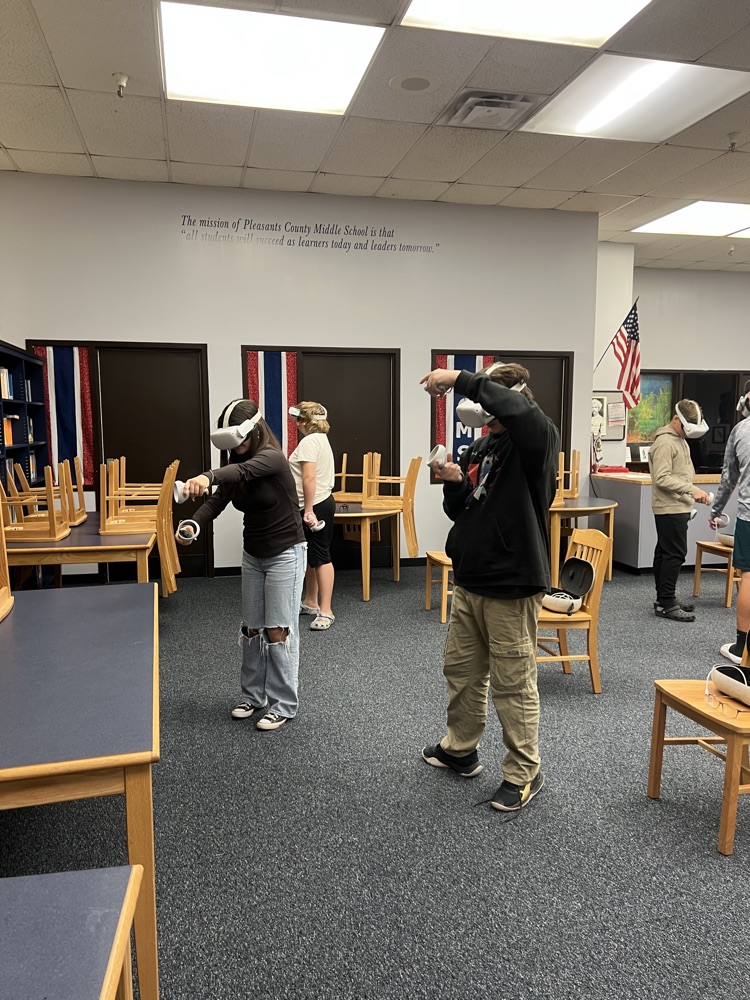 8th grade students using virtual reality headsets during a Workforce WV career exploration activity at PCMS.