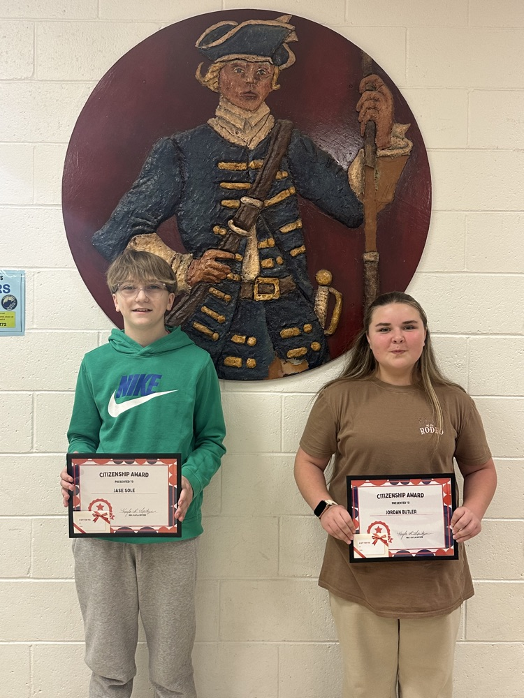 citizenship award winners holding certificate and gift card