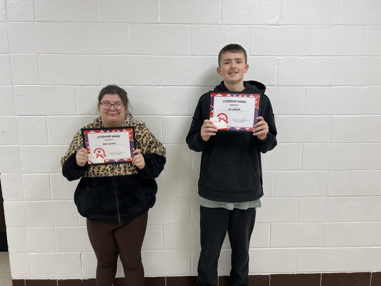 citizenship award winners holding certificate and gift card