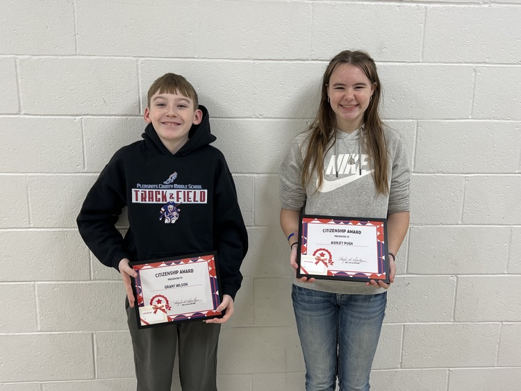 citizenship award winners holding certificate and gift card