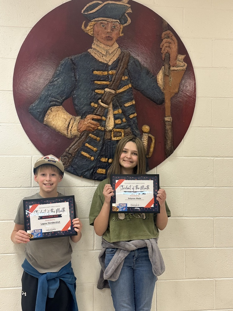 students of the month holding awards and Dominos gift card