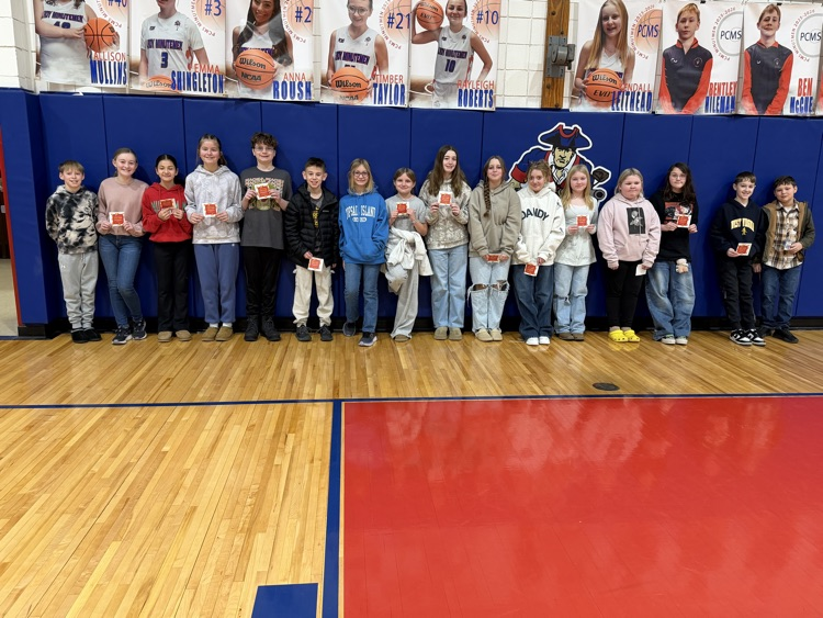 Celebrating success with a pizza party. Students pose.