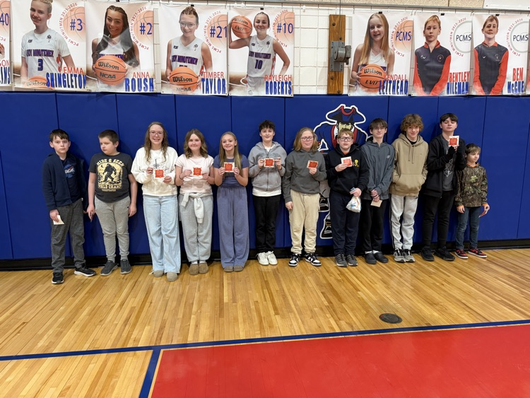 Celebrating success with a pizza party. Students pose.