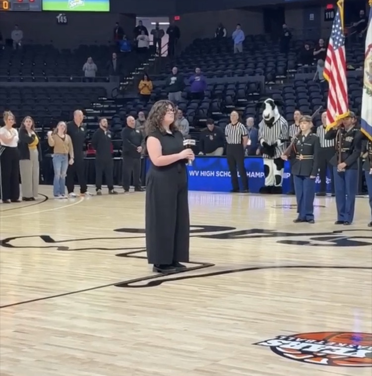 student singing at a basketball game 