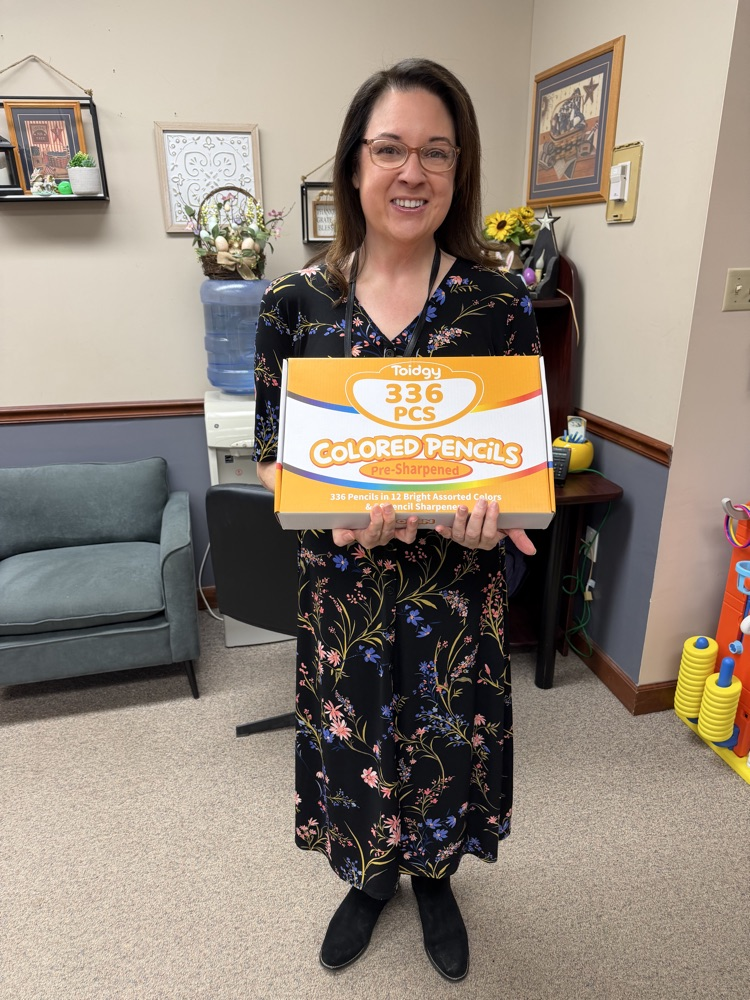 Kindness Week - Teacher holding gift