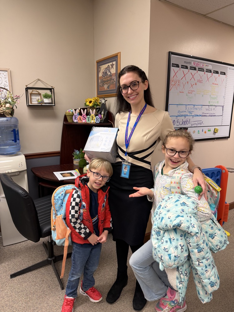 Kindness Week - Teacher holding gift