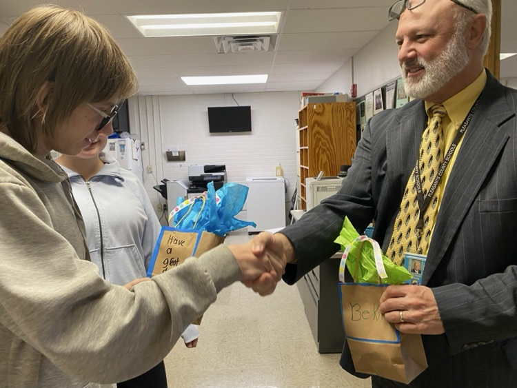 Kindness week cookie delivery, students handing out cookies to people in our community