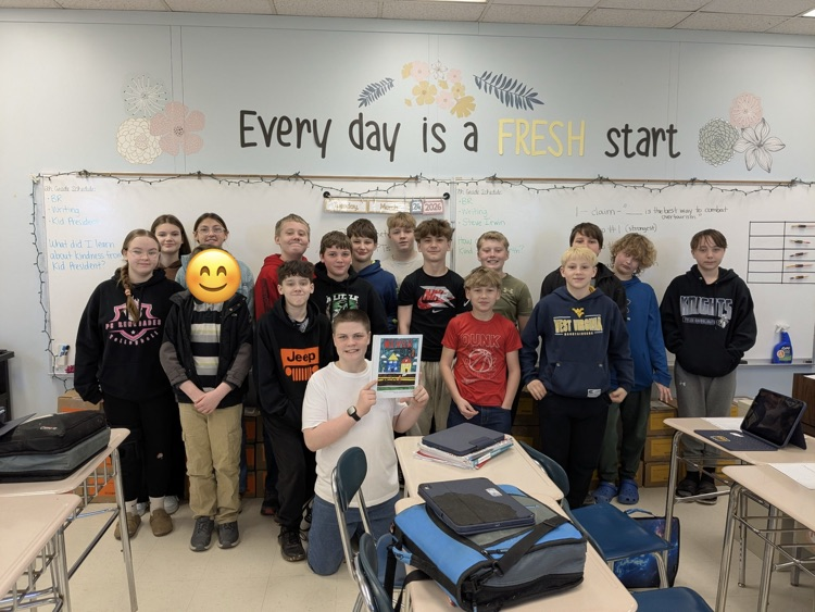 students published their own books in ELA class. posing as a class